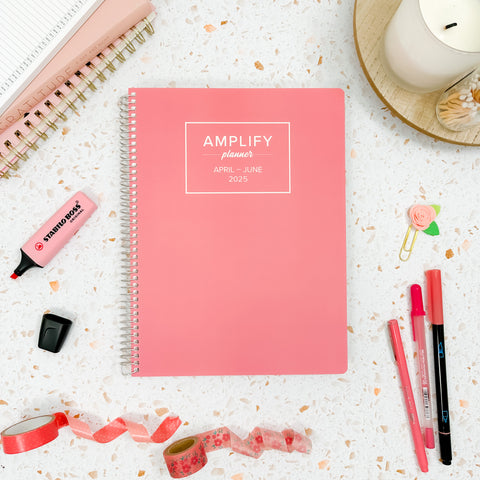 petal pink 2025 daily amplify planner on styled background